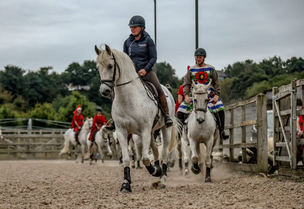 Horses and riders warm up together before taking the stage for Saturday-night performances of Kynren - An Epic Tale of England