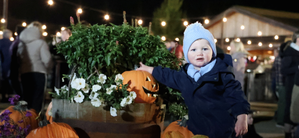 Child plays with Pumpkins at Kynren's Pyromusical