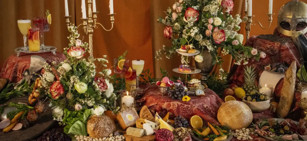 a medieval banquet table laden with food