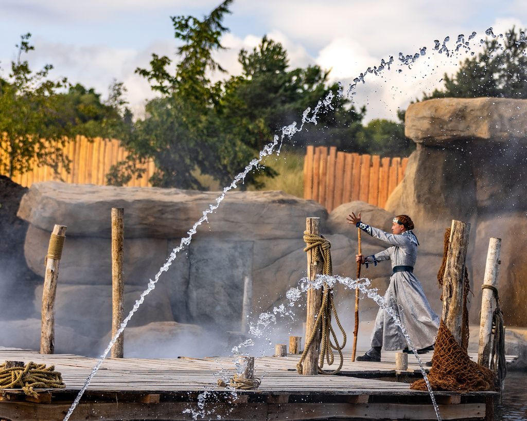 fountain jets erupt from a lake as a witch uses her magic in Legend of the Wear, one of the shows in Kynren - The Storied Lands